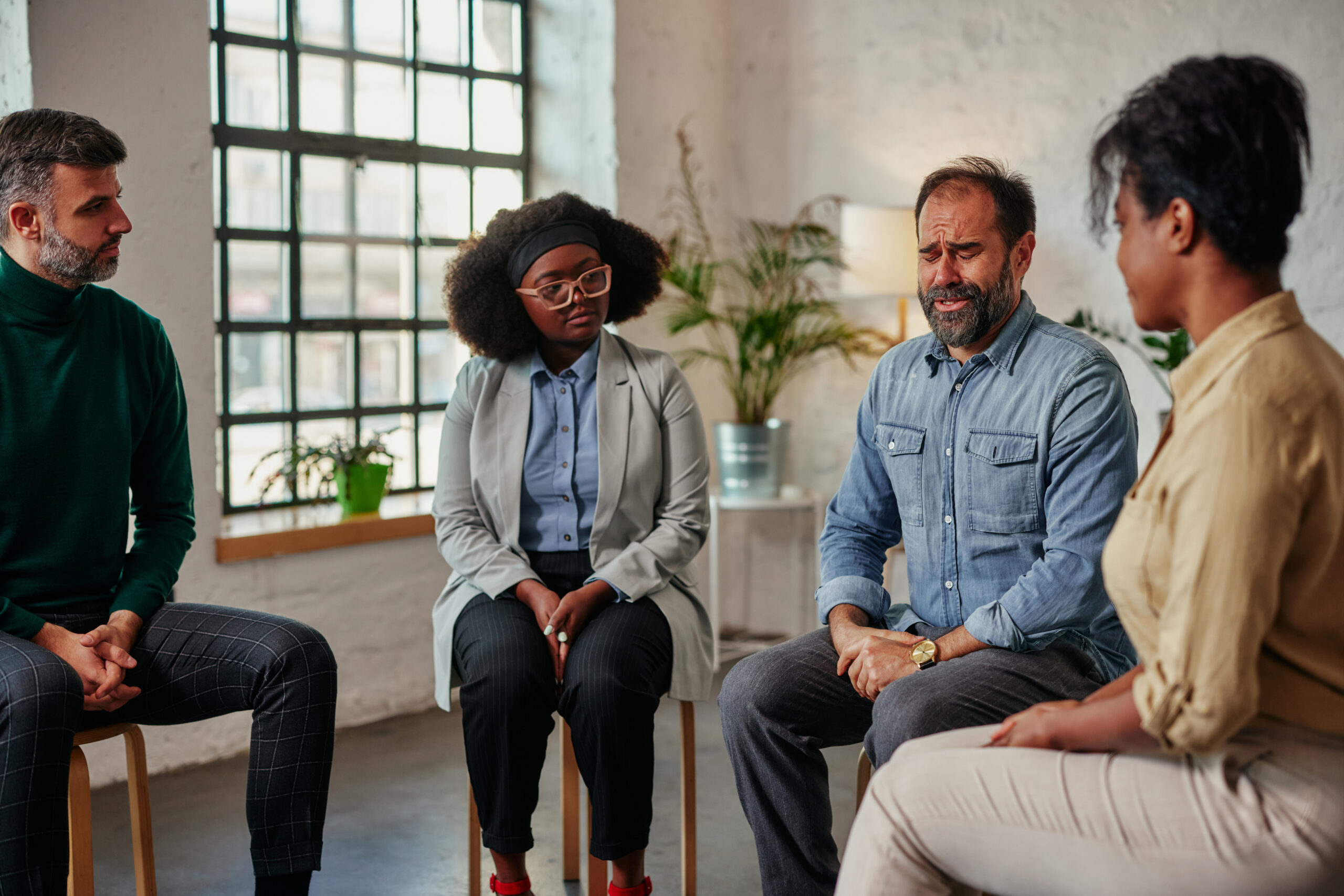 Group of diverse adult people t mental health therapy